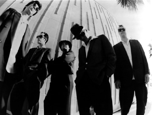 While the band got cred points for being equal opportunity employers, they never hired the midget photographer again.