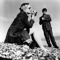 David knew Sally had a pair of legs that could stop traffic, but even after being buried to the neck, the photographer kept cropping him out. He cracked his knuckles. It was time to get rough.