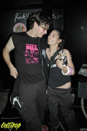 Michele slips the latest issue into Jake Zfrnrana....'s of NYCs' Knitting Factory's pocket. | Photo by Jonathan Marder