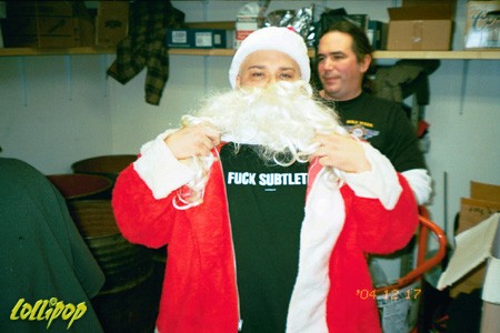 Eric Corbin wearing his Fuck Subtlety shirt beneath his Santa suit and Da' Core's 9th annual X-mas bash.