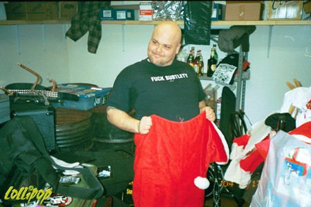Eric Corbin wearing his Fuck Subtlety shirt beneath his Santa suit and Da' Core's 9th annual X-mas bash.